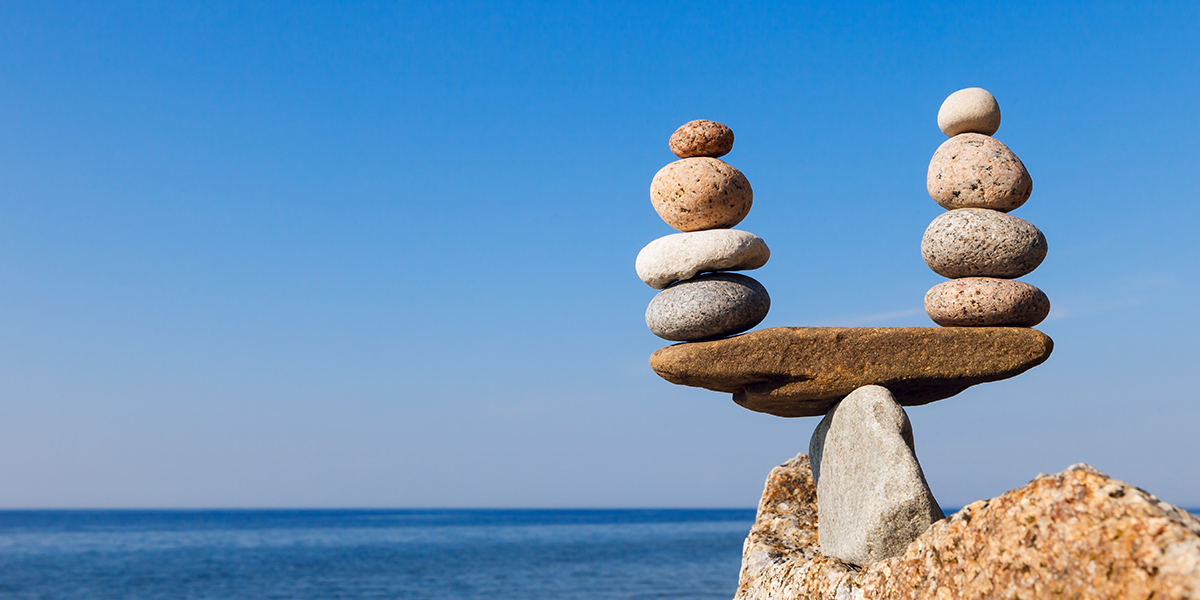 Concept of harmony and balance. Balance and poise  stones against the sea. Rock zen in the form of scales