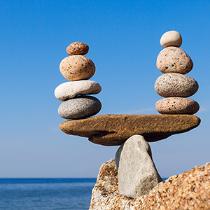 Concept of harmony and balance. Balance and poise  stones against the sea. Rock zen in the form of scales