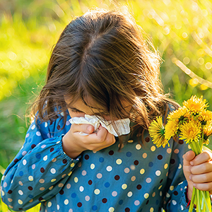 Child girl allergic to flowers. Selective focus. allergy.